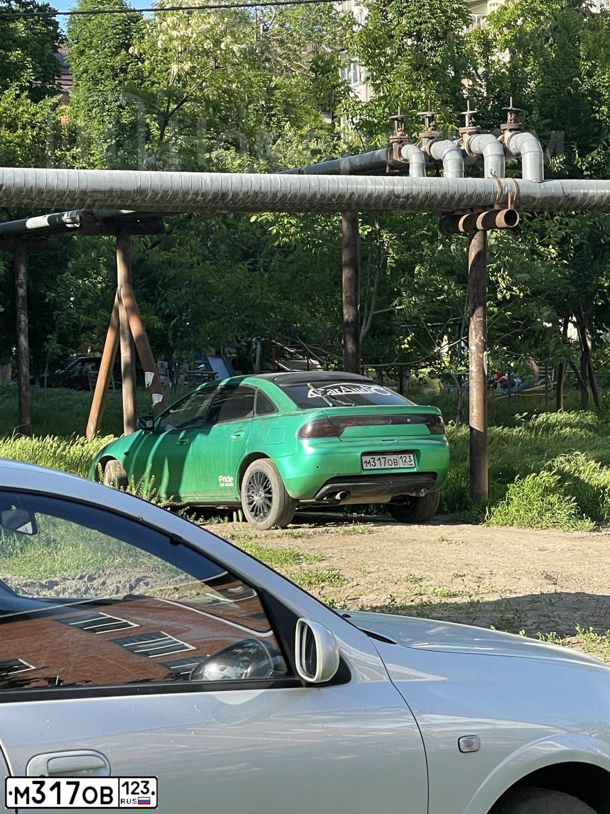 Фото автомобиля MAZDA 323, 1995 — госномер М317ОВ123. Цвет: ЗЕЛЕНЫЙ