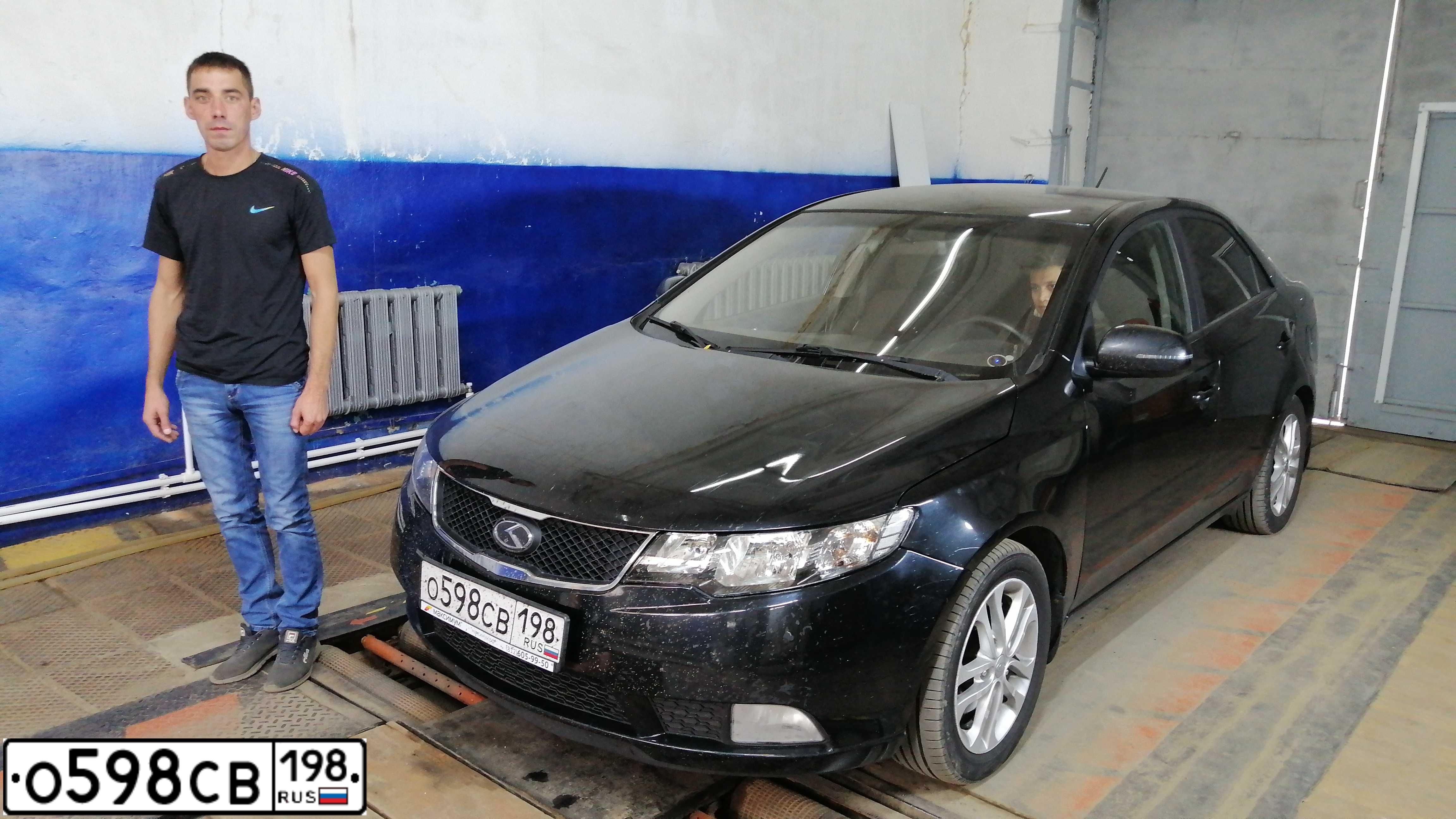 Фото автомобиля KIA CERATO, 2011 — госномер М124СМ21. Цвет: ЧЕРНЫЙ