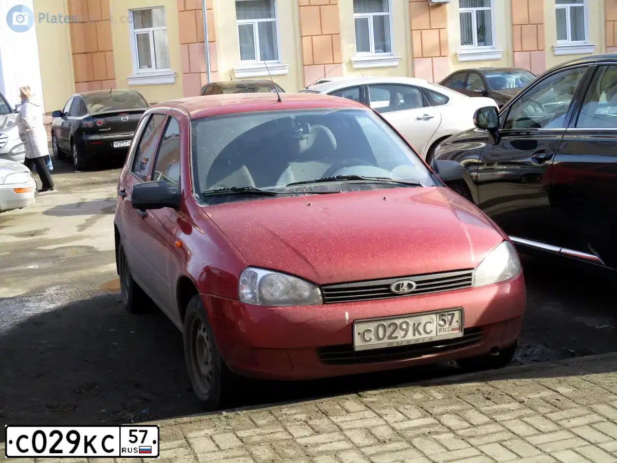 Фото автомобиля LADA 1117 KALINA, 2012 — госномер С029КС57. Цвет: СЕРЕБРИСТО-КРАСНЫЙ