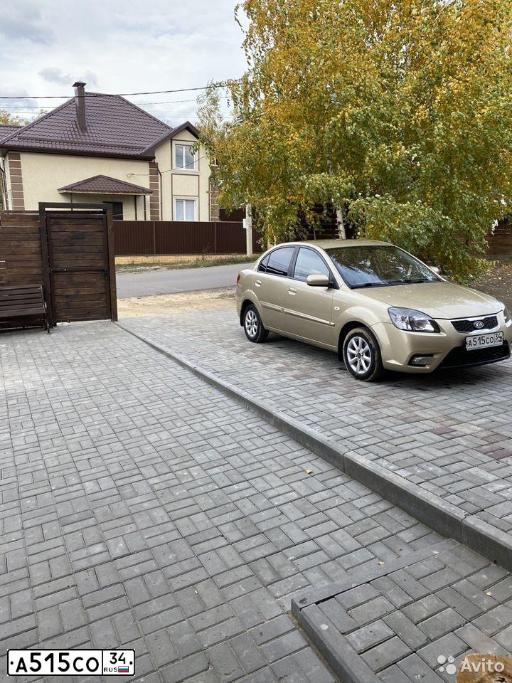 Фото автомобиля KIA RIO, 2009 — госномер О052ЕС136. Цвет: БЕЖЕВЫЙ