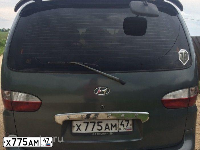 Фото автомобиля HYUNDAI H 1/H 100/STAREX, 2001 — госномер Х775АМ47. Цвет: ТЕМНО-СЕРЫЙ