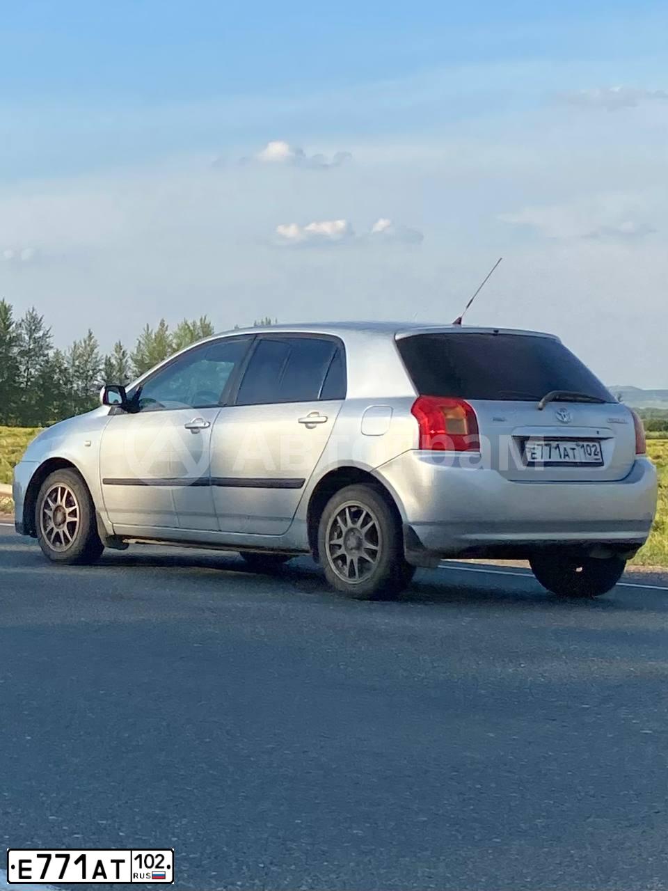 Фото автомобиля TOYOTA COROLLA, 2003 — госномер Н202ОС702. Цвет: Серебристый