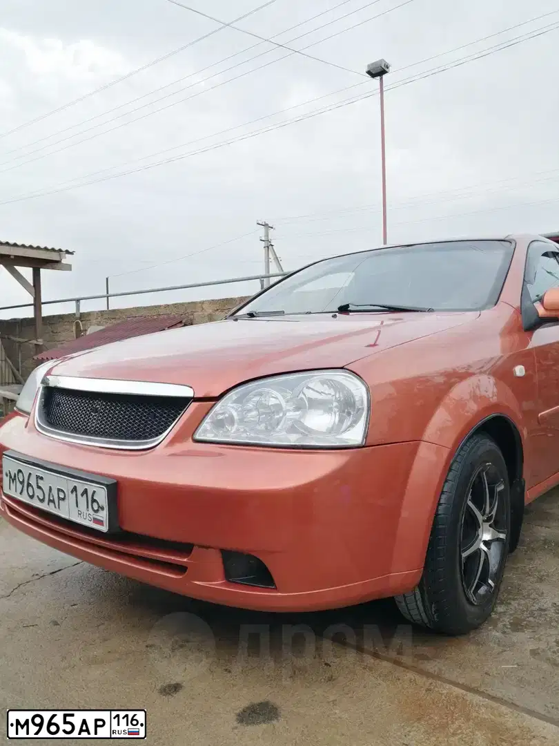 Фото автомобиля CHEVROLET LACETTI, 2007 — госномер К064АН82. Цвет: Оранжевый