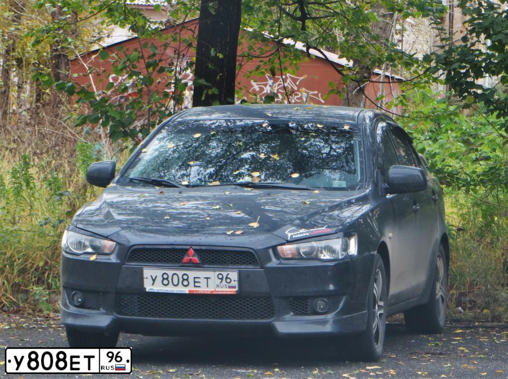 Фото автомобиля MITSUBISHI LANCER, 2008 — госномер Т141РВ196. Цвет: ЧЕРНЫЙ