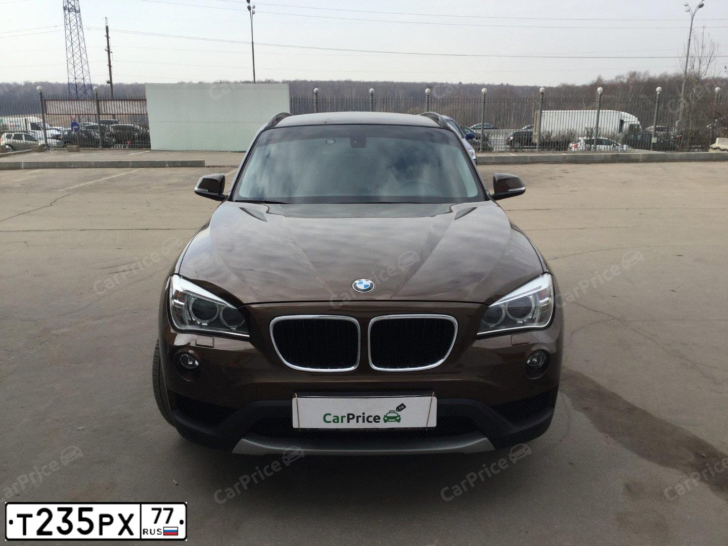 Фото автомобиля BMW X1, 2013 — госномер Т235РХ77. Цвет: КОРИЧНЕВЫЙ