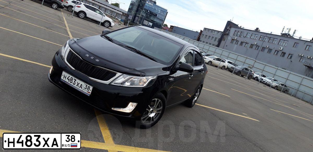 Фото автомобиля KIA RIO, 2012 — госномер В018ММ03. Цвет: ЧЕРНЫЙ