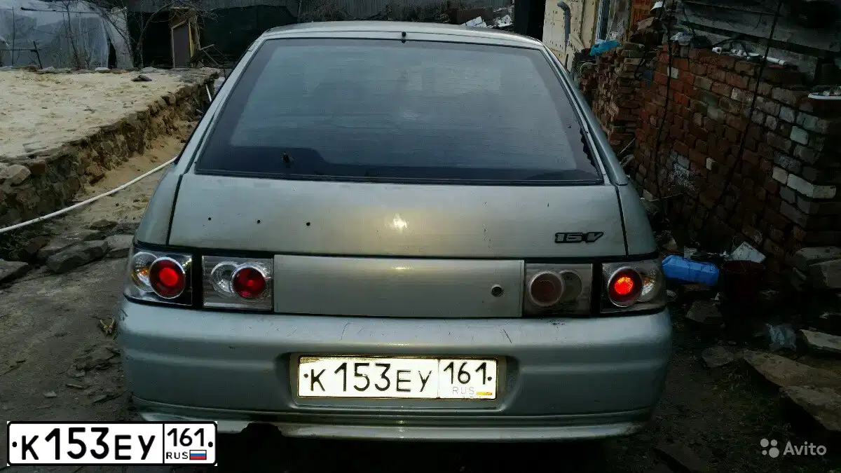 Фото автомобиля LADA 2112, 2002 — госномер К153ЕУ161. Цвет: СЕРЕБР.ЖЕЛТО-ЗЕЛЕНЫЙ