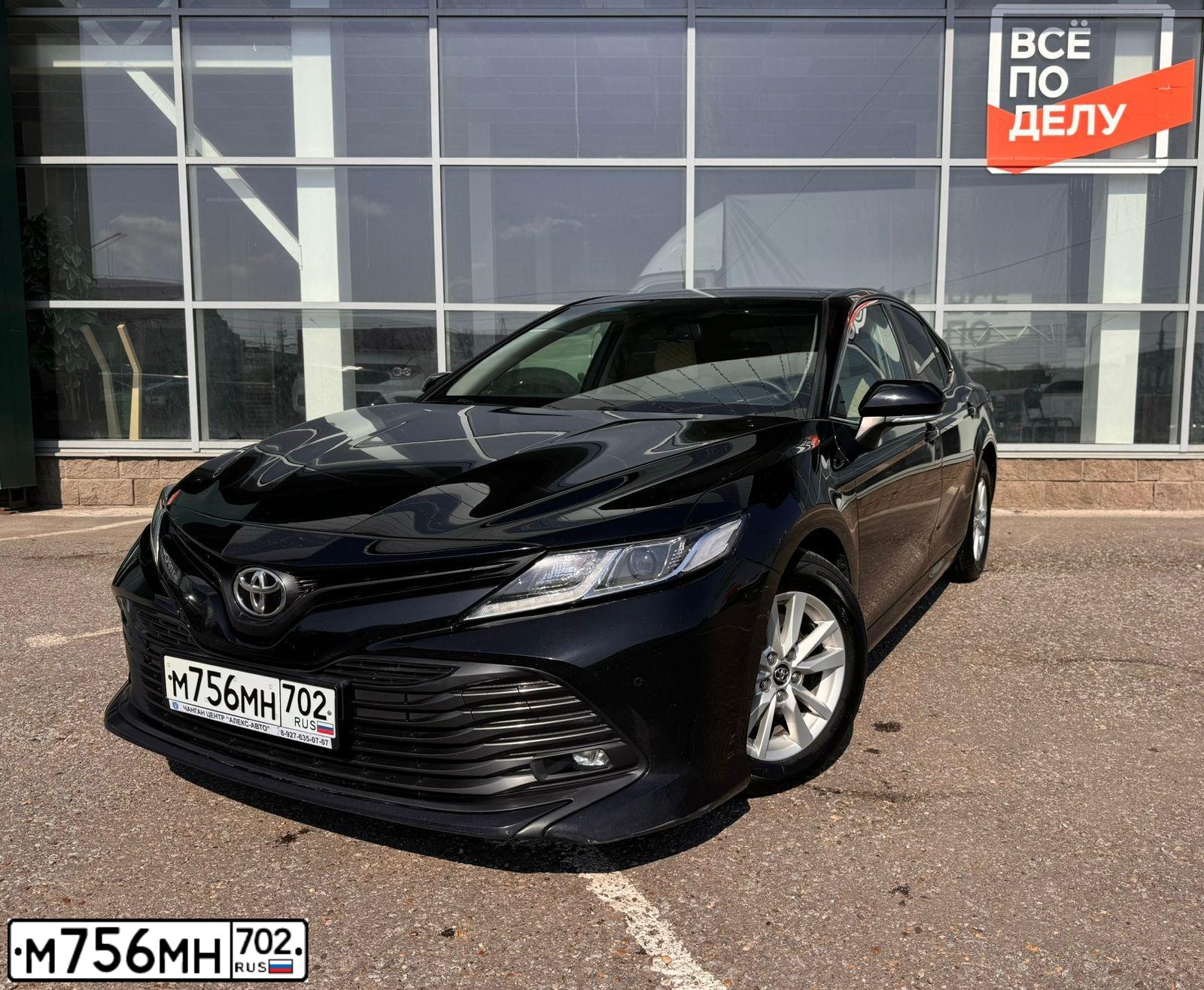 Фото автомобиля TOYOTA CAMRY, 2019 — госномер М756МН702. Цвет: ЧЕРНЫЙ МЕТАЛЛИК