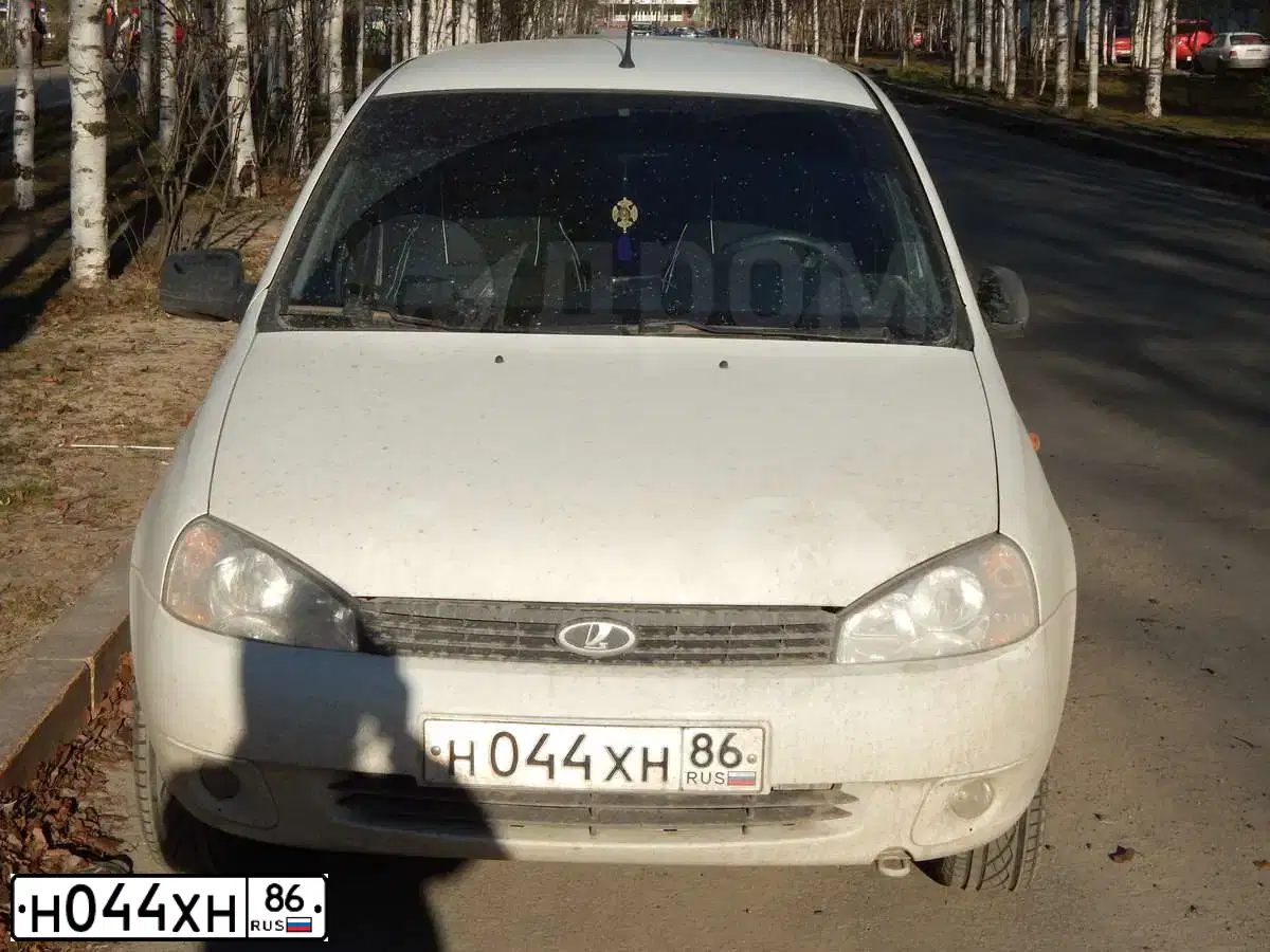 Фото автомобиля LADA 1117 KALINA, 2012 — госномер Н044ХН86. Цвет: Белый