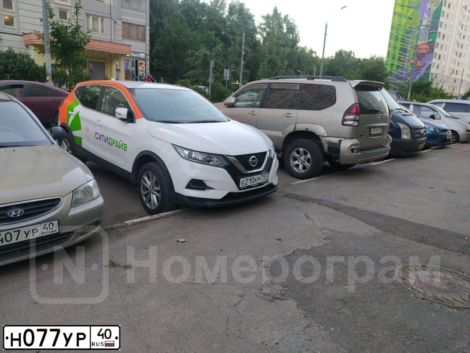 Фото автомобиля CHEVROLET AVEO, 2014 — госномер Н077УР40. Цвет: ЧЕРНЫЙ МЕТАЛЛИК