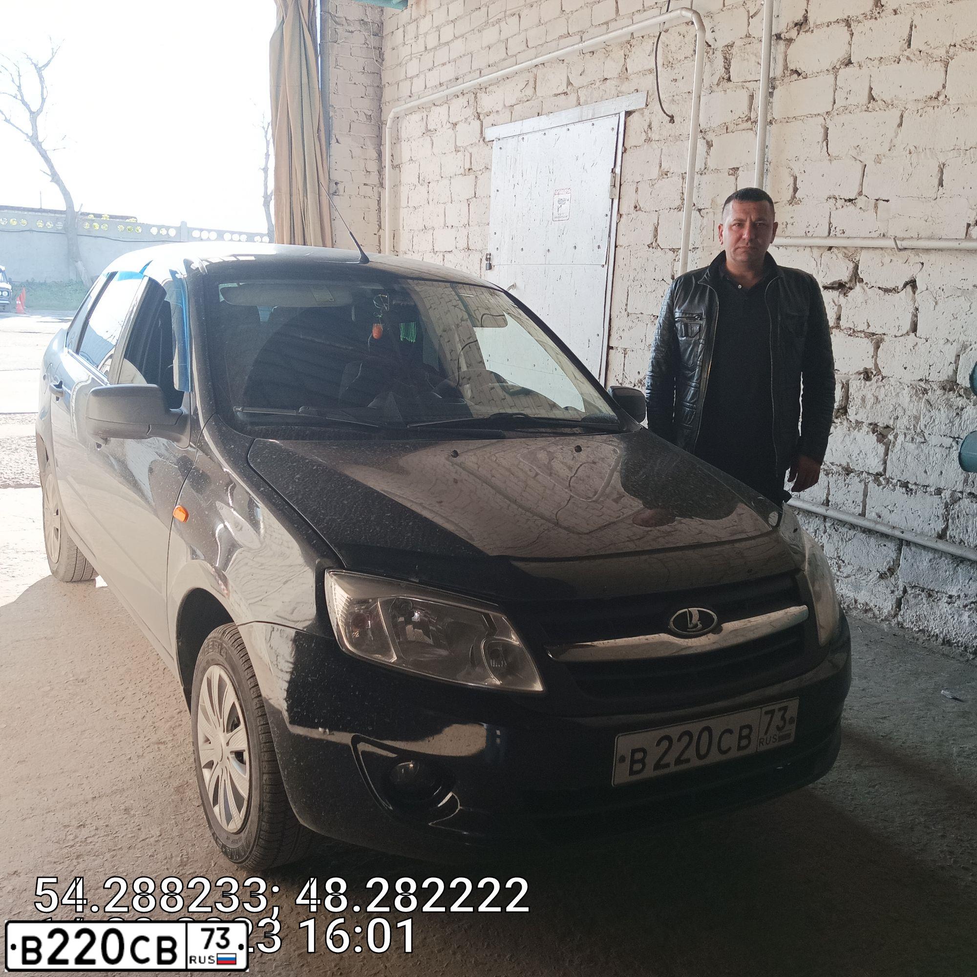 Фото автомобиля LADA 2190 GRANTA, 2013 — госномер В220СВ73. Цвет: Сине-Черный