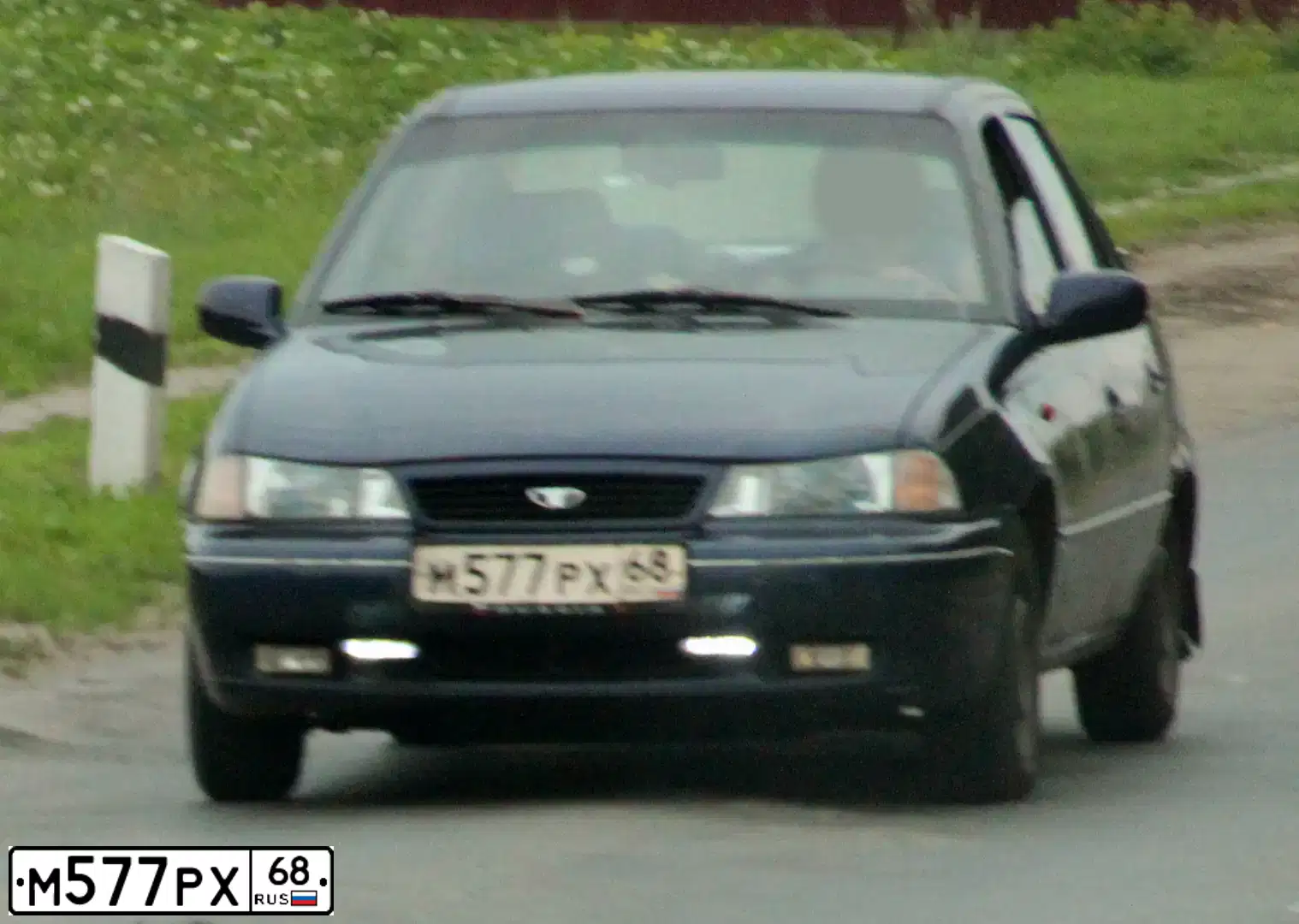 Фото автомобиля DAEWOO NEXIA, 1998 — госномер К473РН164. Цвет: синий