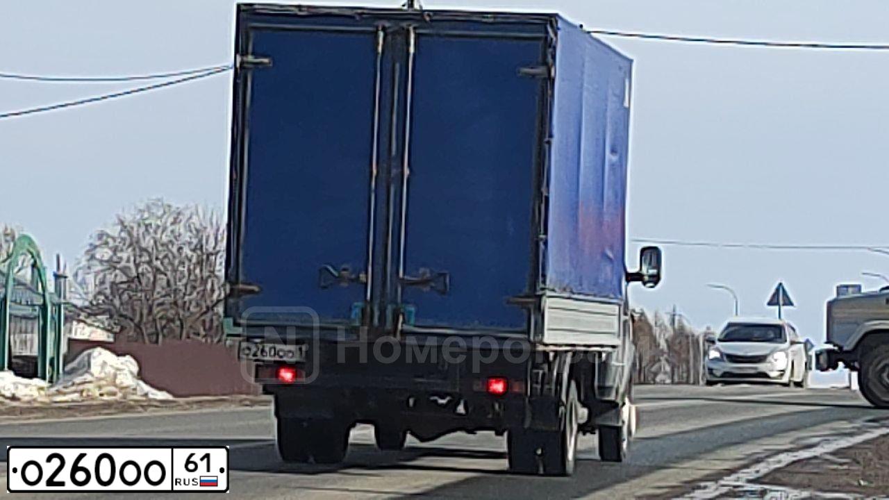 Фото автомобиля GAZ 3110 WOLGA, 2000 — госномер О260ОО61. Цвет: ЧЕРНЫЙ