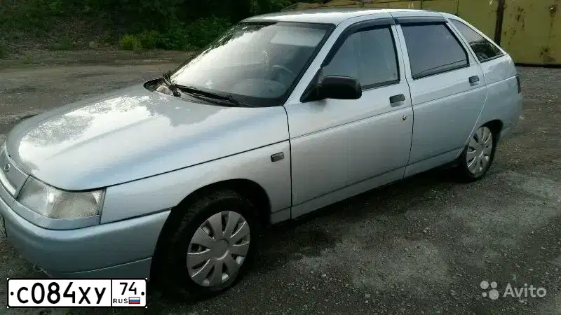 Фото автомобиля LADA 2112, 2003 — госномер С084ХУ74. Цвет: СЕРЕБРИСТО-ГОЛУБОЙ