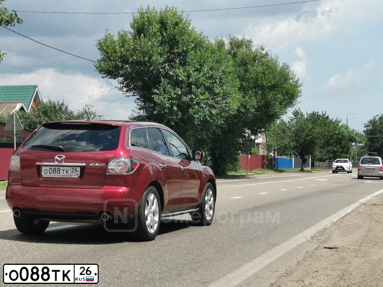 Фото автомобиля MAZDA CX-7, 2011 — госномер О088ТК26. Цвет: КРАСНЫЙ