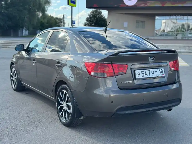 Фото автомобиля KIA CERATO, 2010 — госномер В757ТР102. Цвет: бронзовый