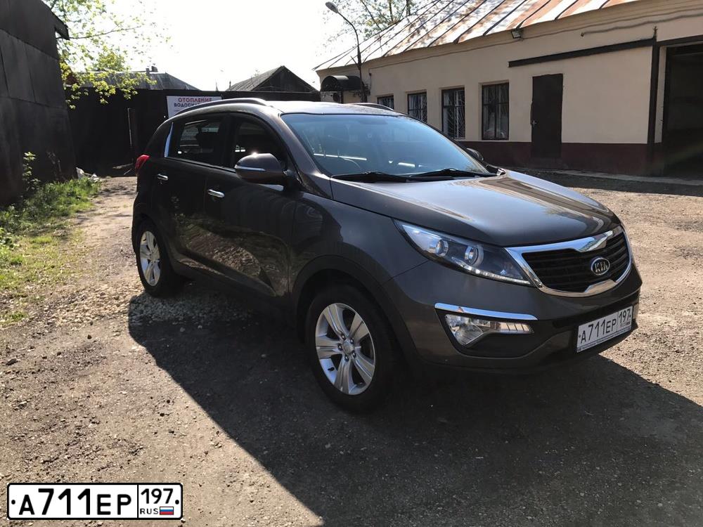 Фото автомобиля KIA SPORTAGE, 2010 — госномер О707РВ33. Цвет: Коричневый