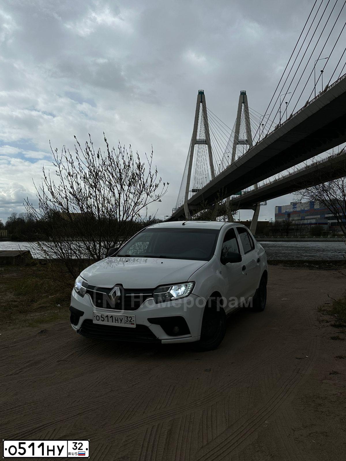 Фото автомобиля RENAULT T LOGAN, 2019 — госномер О511НУ32. Цвет: БЕЛЫЙ-ЖЕЛТЫЙ-СЕРЫЙ
