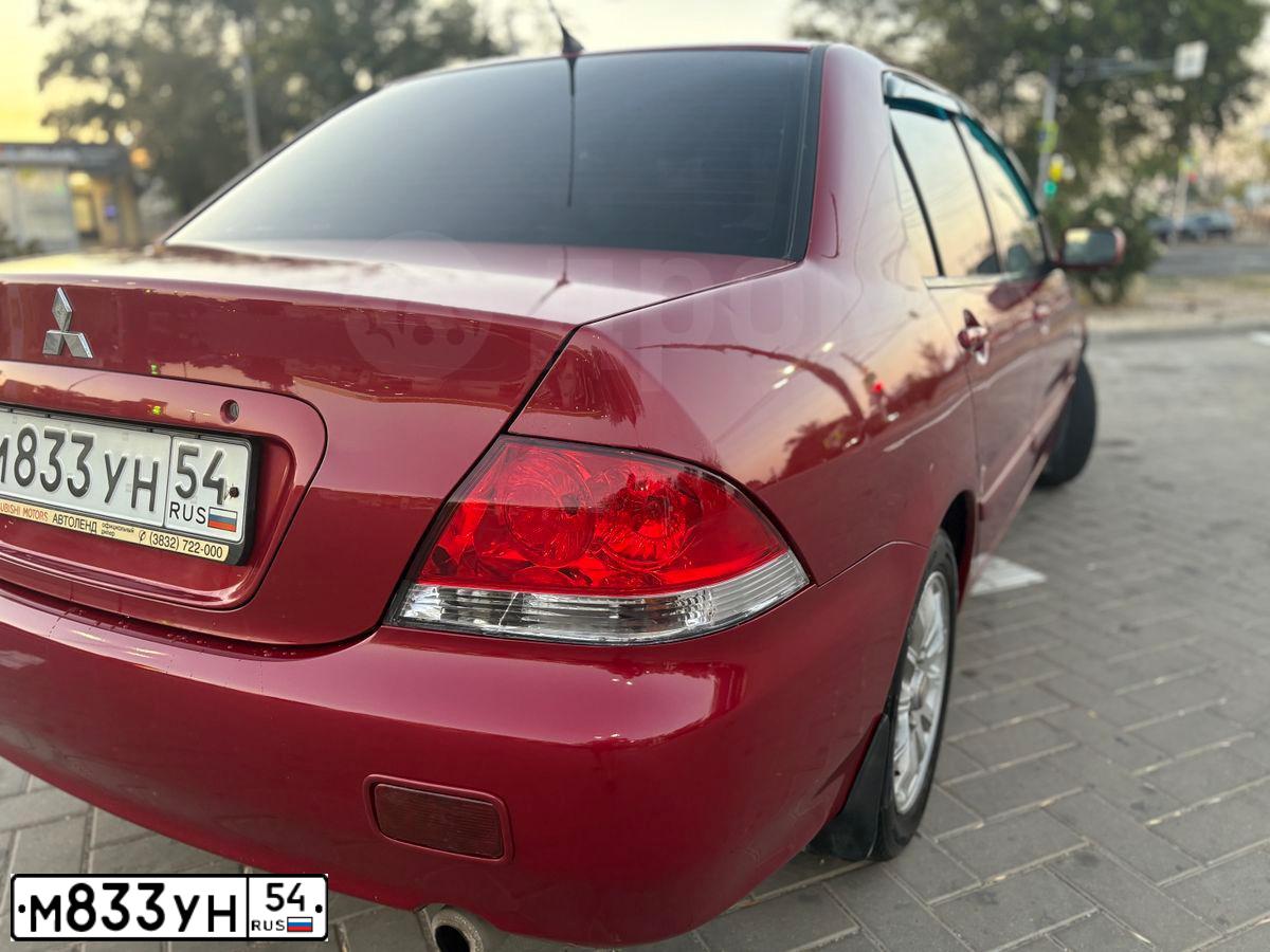 Фото автомобиля MITSUBISHI LANCER, 2005 — госномер Е081МУ11