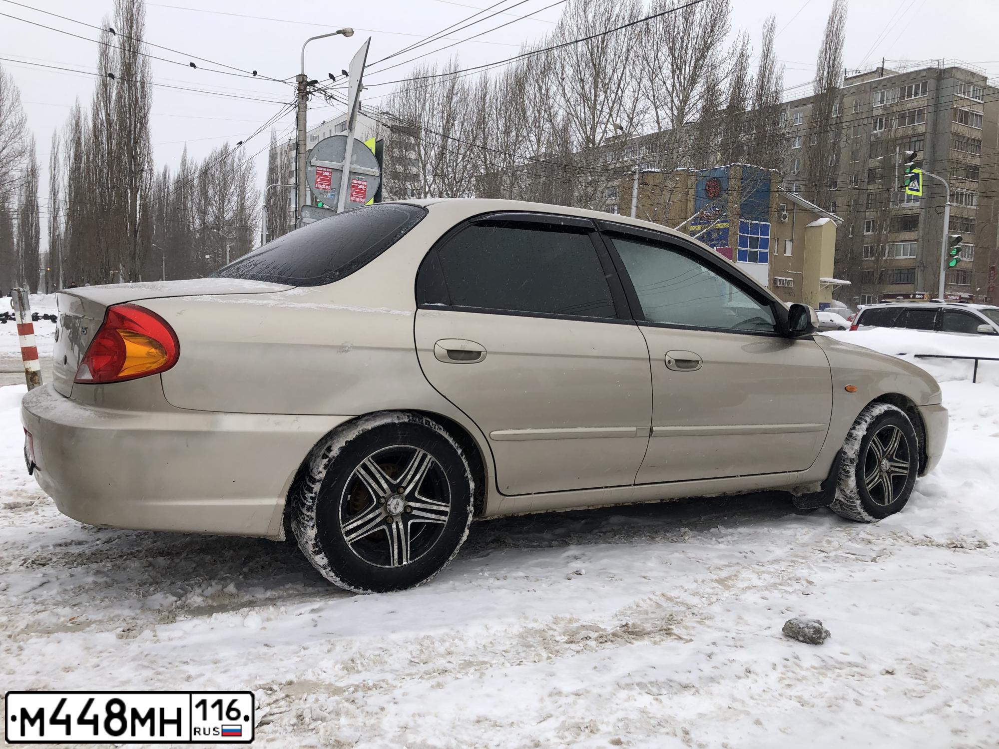 Фото автомобиля KIA SPECTRA, 2009 — госномер К126КМ702. Цвет: Золотисто-бежевый