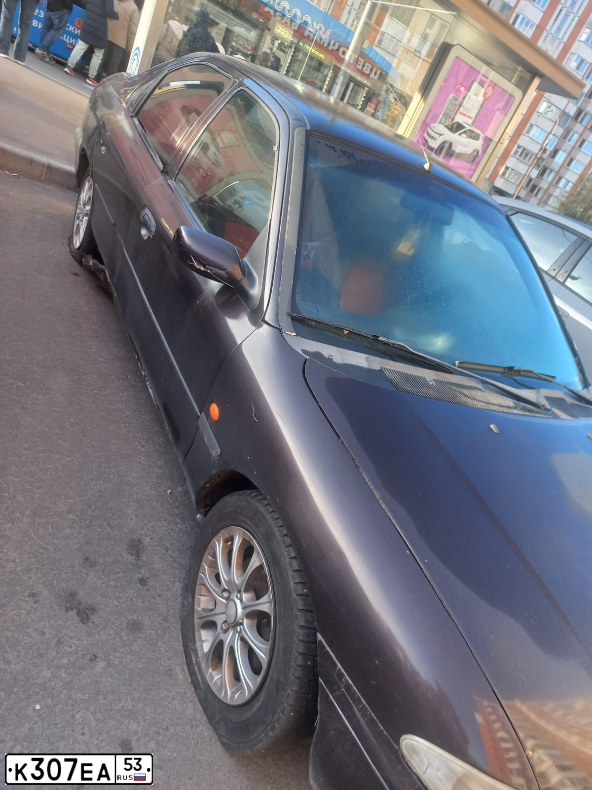 Фото автомобиля FORD MONDEO, 1996 — госномер К307ЕА53. Цвет: ФИОЛЕТОВЫЙ ТЕМНЫЙ