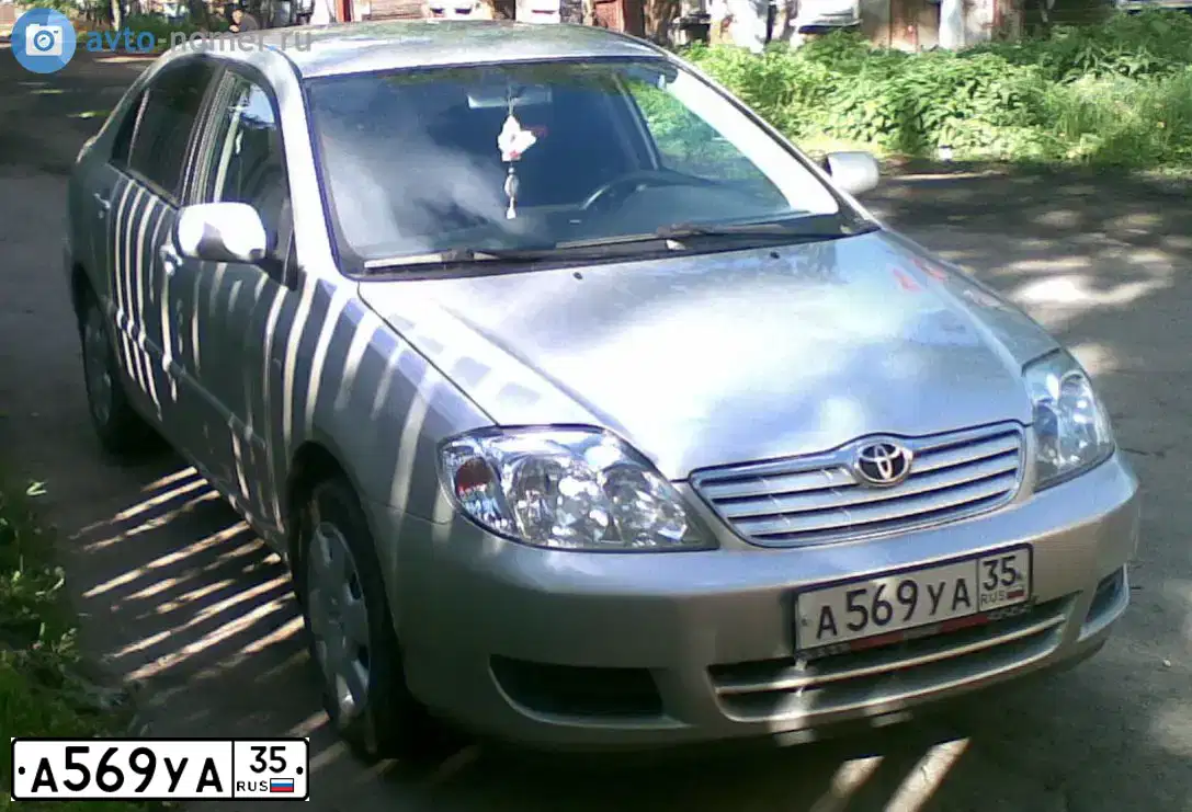 Фото автомобиля TOYOTA COROLLA, 2005 — госномер М958УА35. Цвет: Серебристый