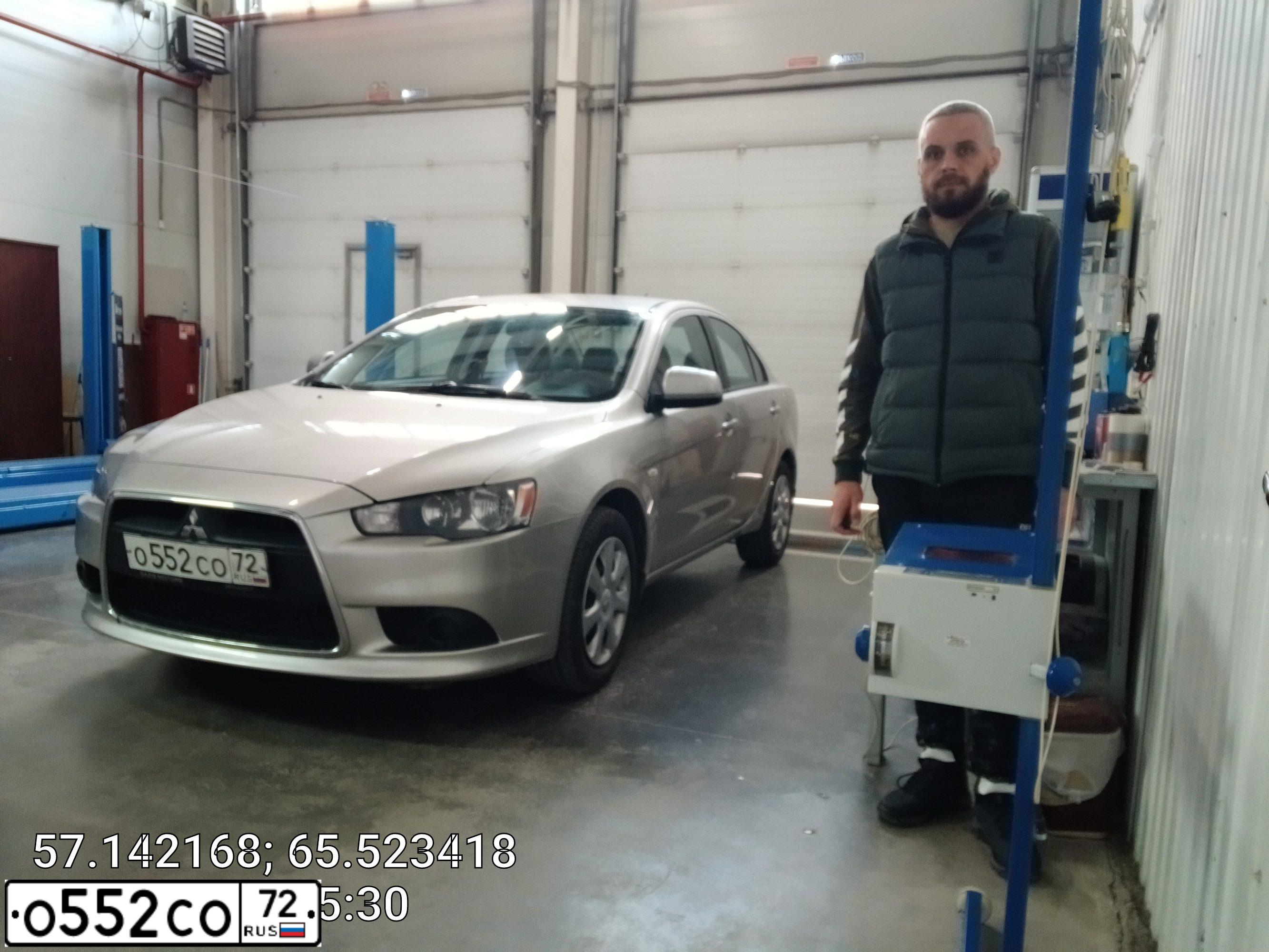 Фото автомобиля MITSUBISHI LANCER, 2012 — госномер А203СВ172. Цвет: серебристый