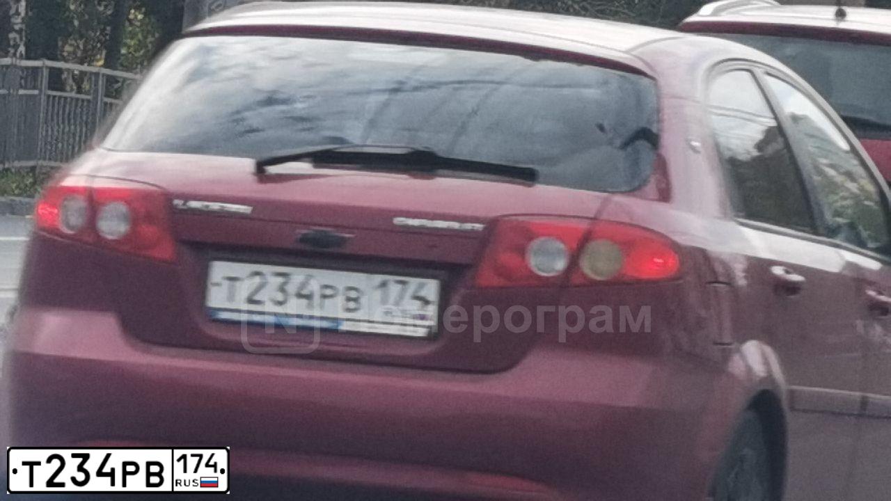 Фото автомобиля CHEVROLET LACETTI, 2012 — госномер Т234РВ174. Цвет: Красный