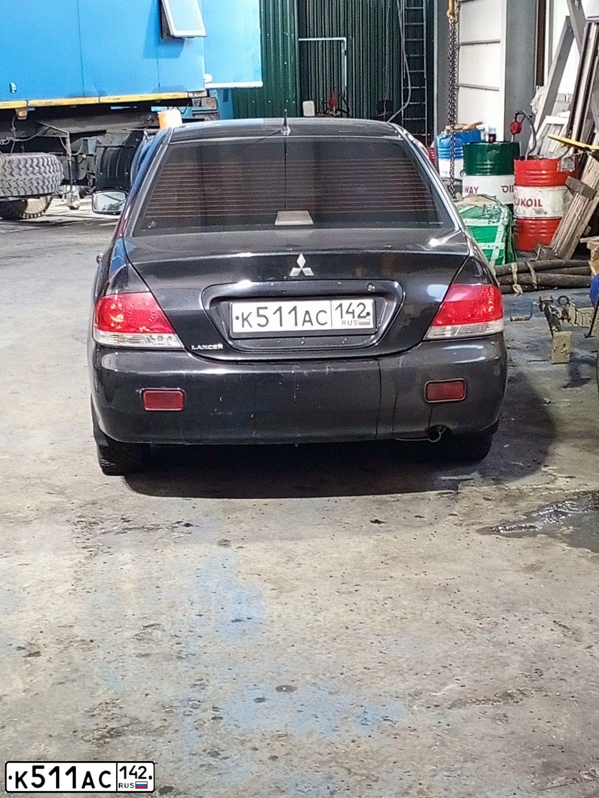 Фото автомобиля MITSUBISHI LANCER, 2006 — госномер К511АС142. Цвет: ЧЕРНЫЙ