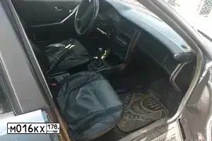 Фото автомобиля MITSUBISHI LANCER, 2006 — госномер М016КХ178. Цвет: СЕРЫЙ