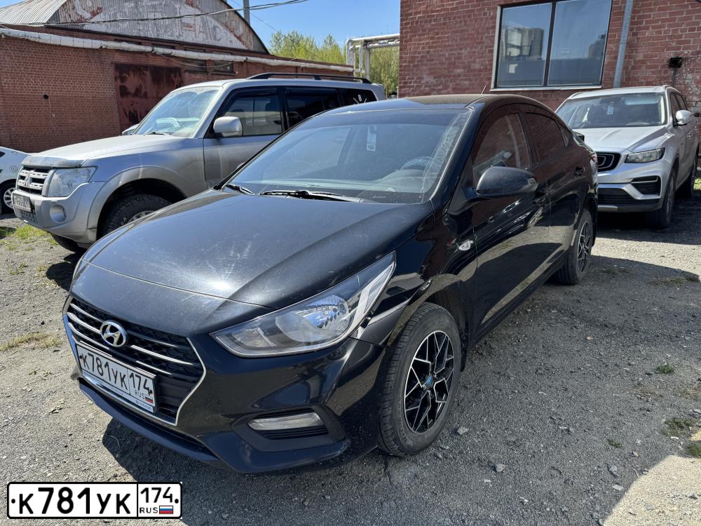 Фото автомобиля HYUNDAI SOLARIS, 2019 — госномер К781УК174. Цвет: ЧЕРНЫЙ