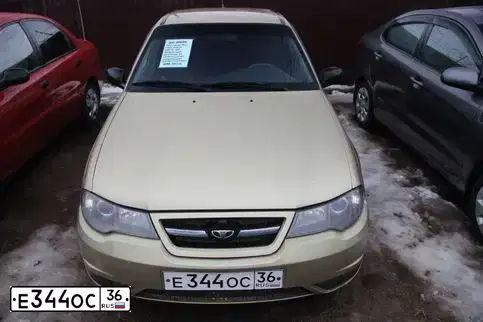Фото автомобиля DAEWOO NEXIA, 2008 — госномер Е344ОС36. Цвет: ПЕСОЧНЫЙ