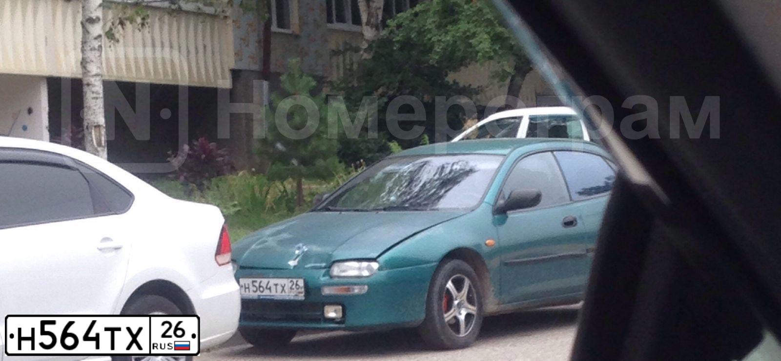 Фото автомобиля MAZDA 323, 1994 — госномер Н564ТХ26. Цвет: ЗЕЛЕНЫЙ