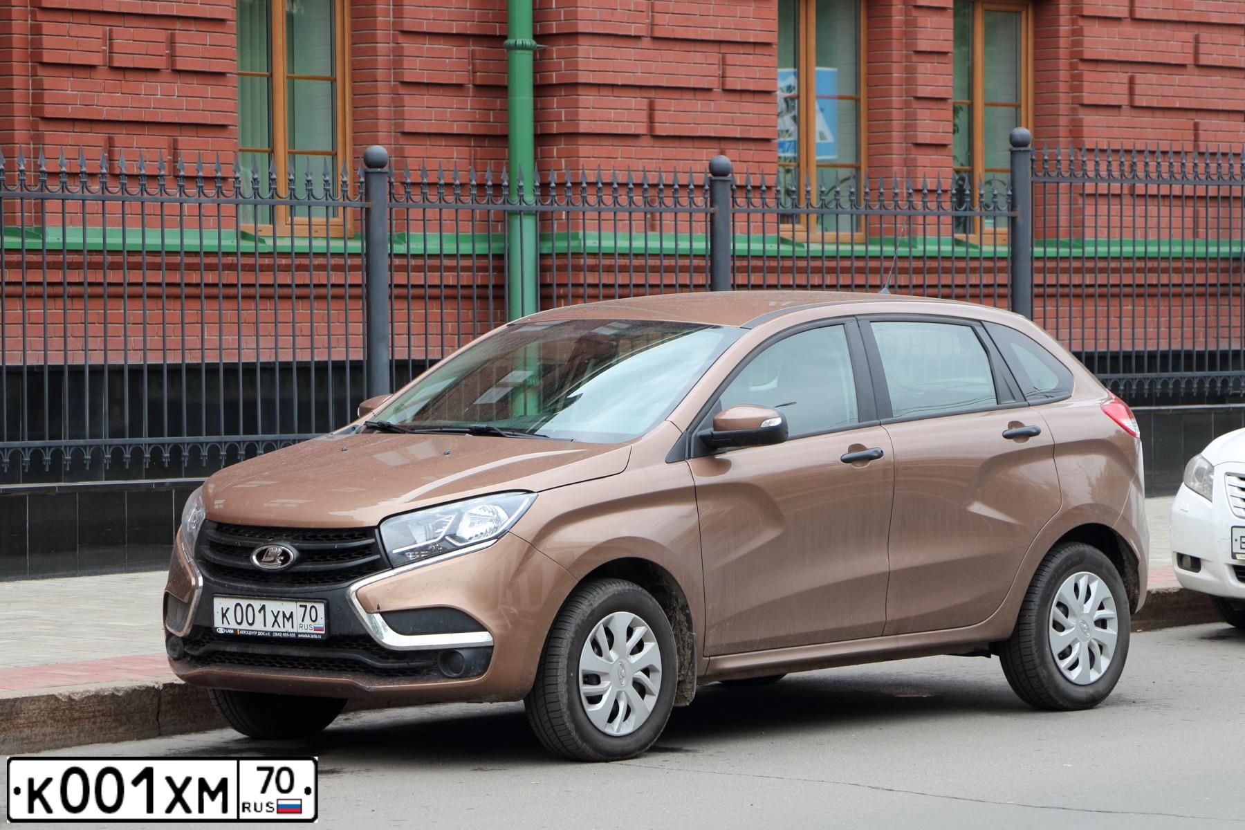 Фото автомобиля LADA XRAY, 2018 — госномер К001ХМ70. Цвет: СВЕТЛО-КОРИЧНЕВЫЙ