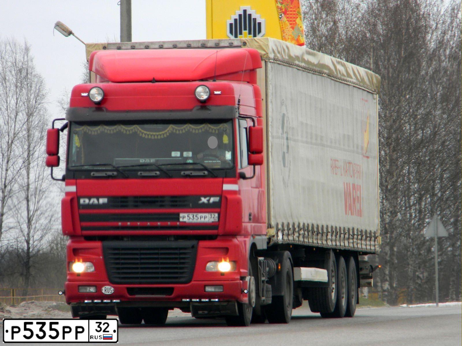 Фото автомобиля DAF XF 95 FT /4X2/, 2005 — госномер Р535РР32. Цвет: ОРАНЖЕВЫЙ
