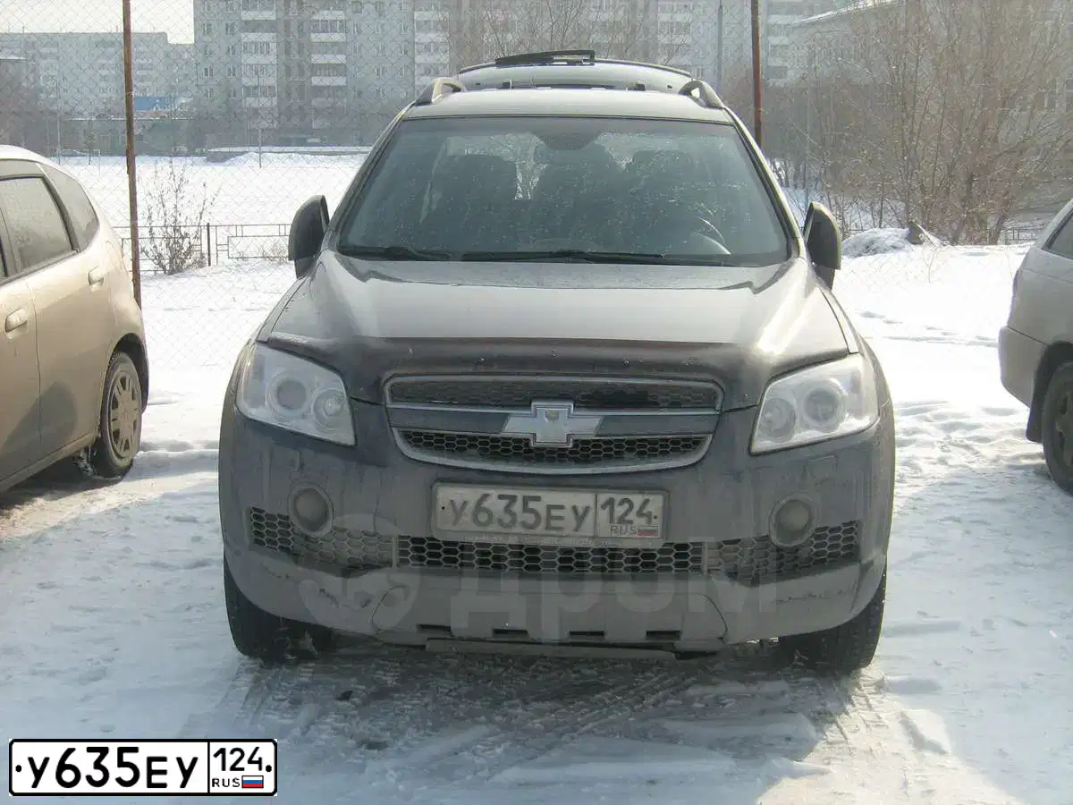 Фото автомобиля CHEVROLET CAPTIVA, 2007 — госномер Е003ХХ177. Цвет: ТЕМНО-СЕРЫЙ
