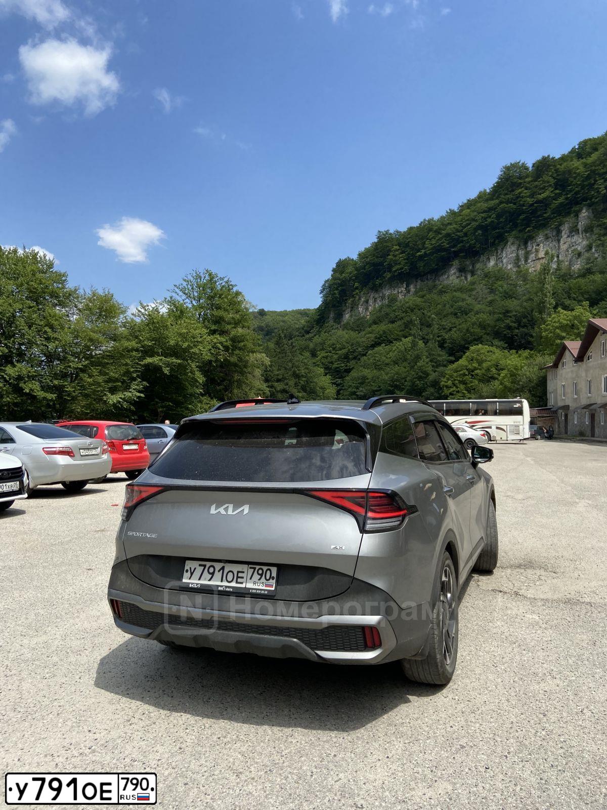 Фото автомобиля KIA SPORTAGE, 2022 — госномер Н299СО15. Цвет: СЕРЫЙ