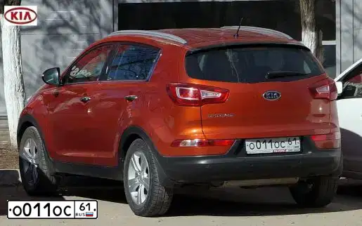 Фото автомобиля KIA SPORTAGE, 2010 — госномер Х802ВО761. Цвет: Оранжевый