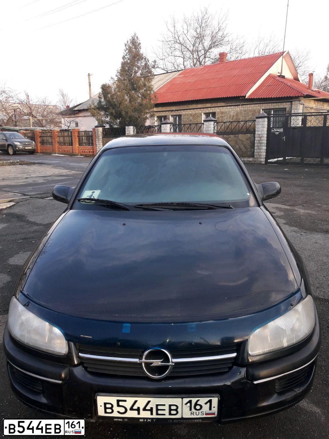 Фото автомобиля OPEL OMEGA, 1995 — госномер В544ЕВ161. Цвет: ЧЕРНО-СИНИЙ