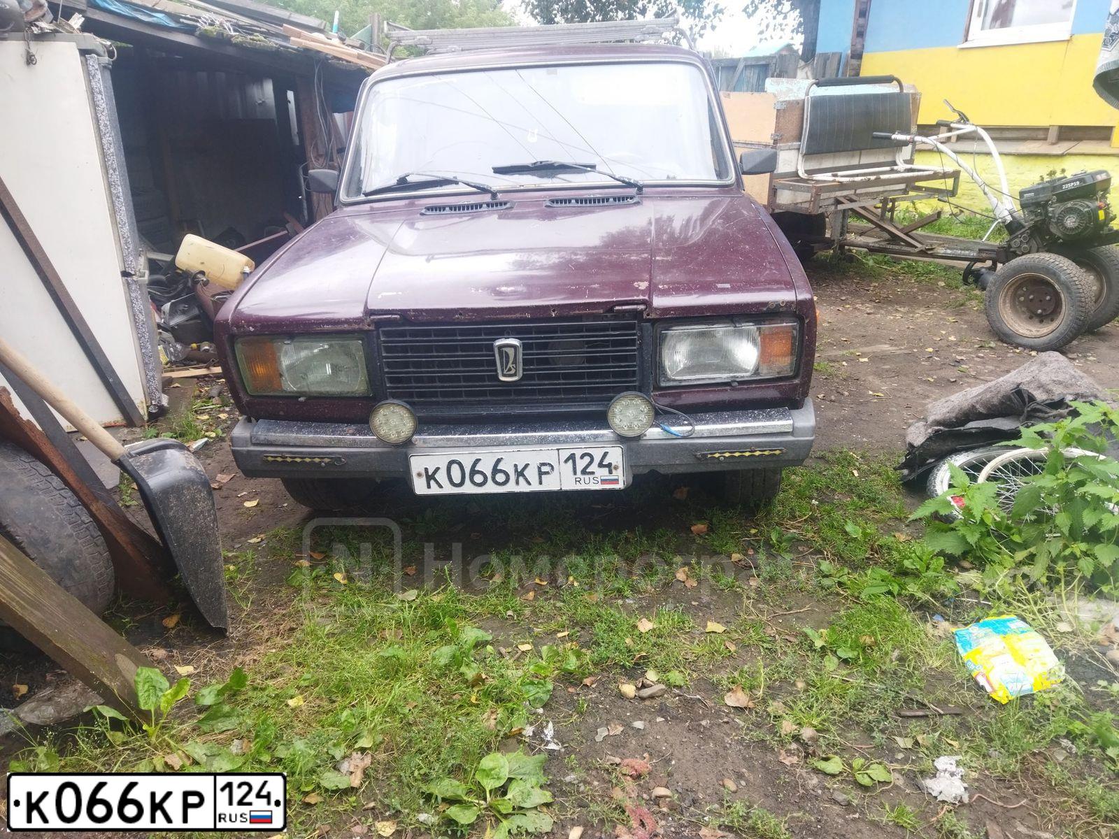 Фото автомобиля LADA 2107 LADA, 2009 — госномер К066КР124. Цвет: Красный
