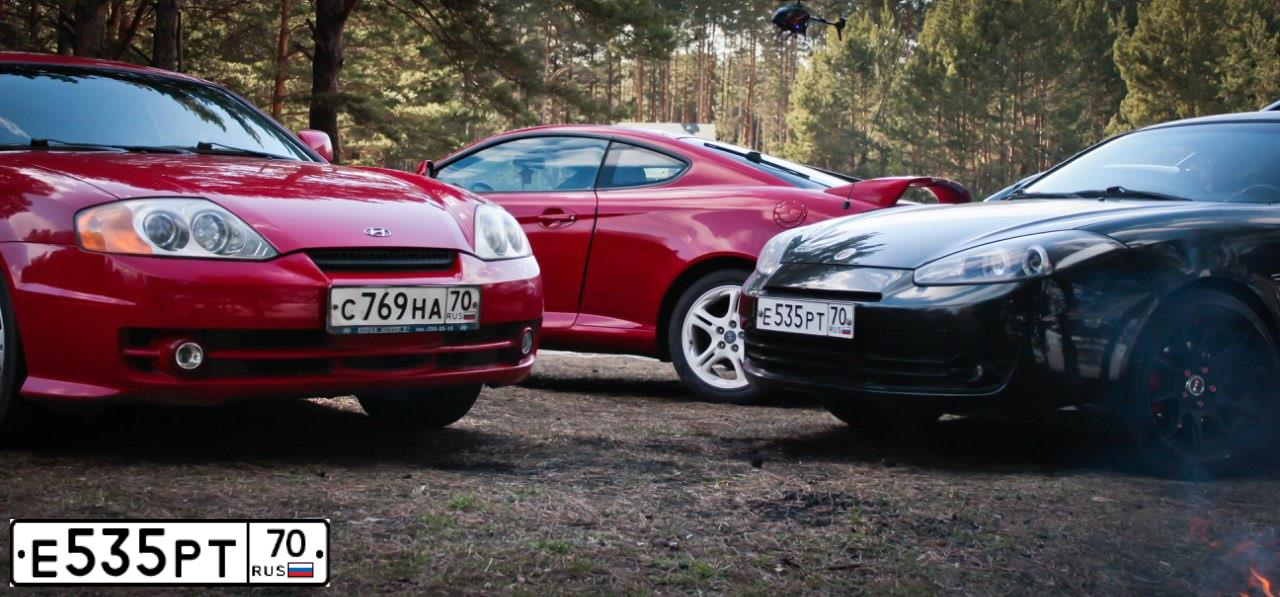 Фото автомобиля HYUNDAI /S-/COUPE / TUSCANI, 2008 — госномер Е718АХ761. Цвет: ЧЕРНЫЙ