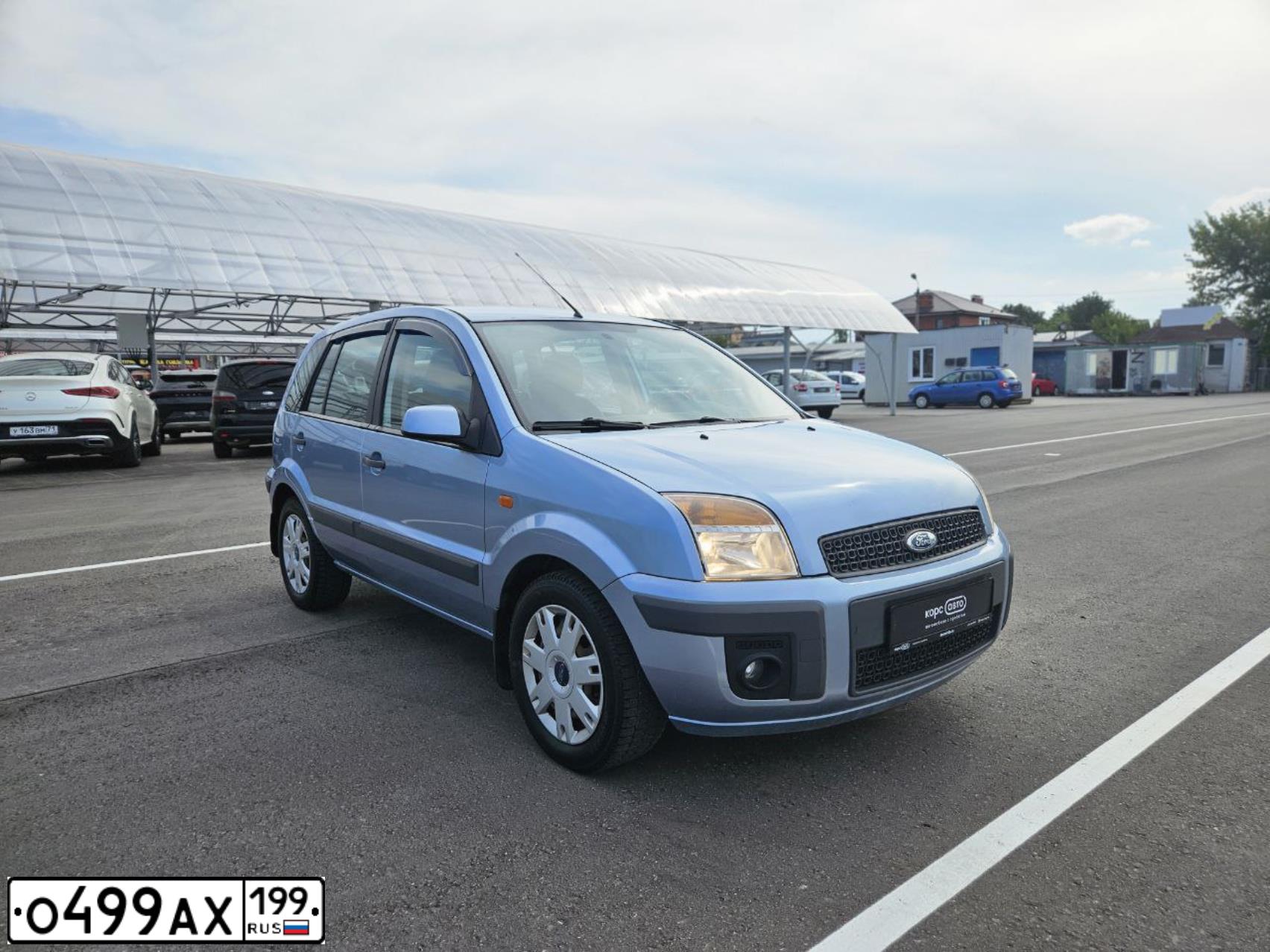 Фото автомобиля FORD FUSION, 2007 — госномер О499АХ199. Цвет: СЕРЫЙ