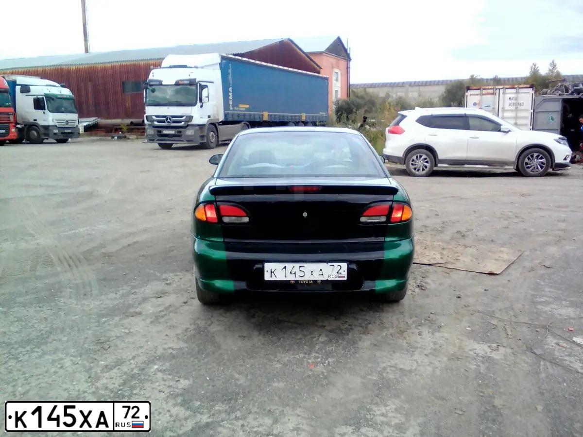 Фото автомобиля TOYOTA CAVALIER, 1999 — госномер К145ХА72. Цвет: ЗЕЛЕНЫЙ