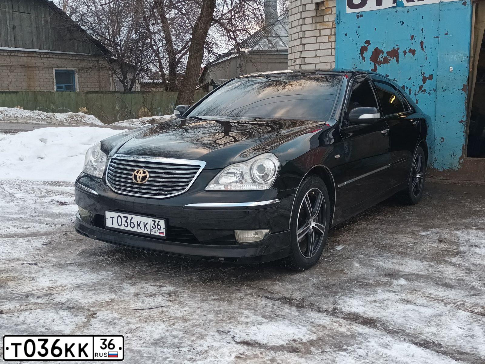 Фото автомобиля LADA 2121 NIVA, 2002 — госномер Т036КК36. Цвет: ФИОЛЕТОВЫЙ