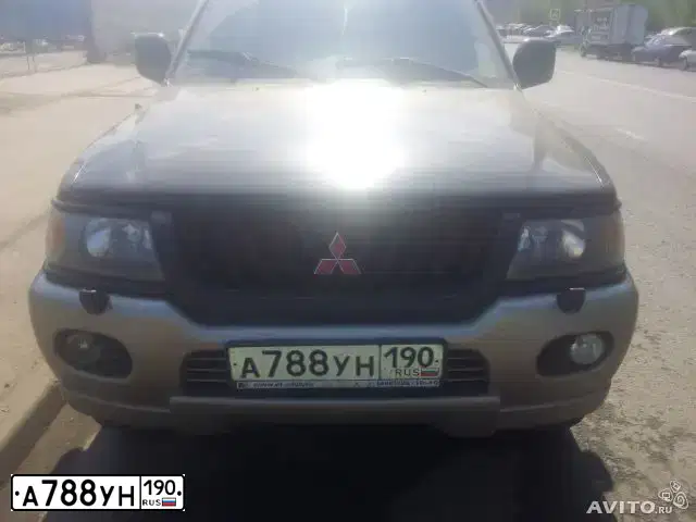 Фото автомобиля MITSUBISHI PAJERO SPORT, 2001 — госномер Е703ОА97. Цвет: ЧЕРНЫЙ