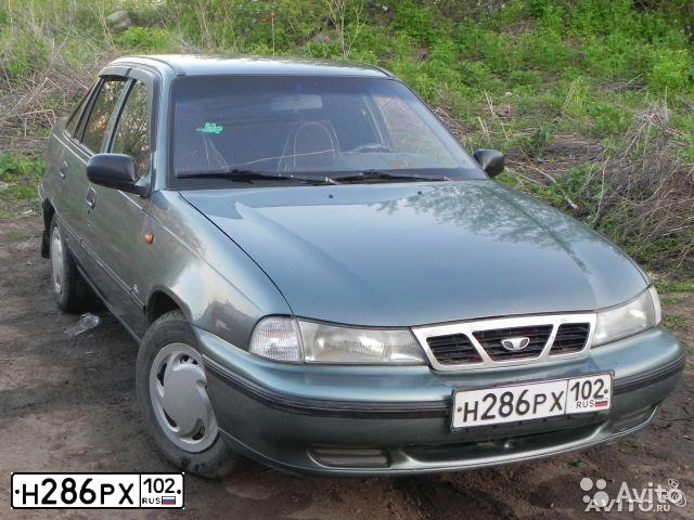 Фото автомобиля DAEWOO NEXIA, 2004 — госномер Н286РХ102. Цвет: СЕРО-ЗЕЛЕНЫЙ