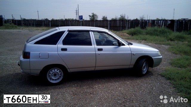 Фото автомобиля LADA 2112, 2003 — госномер Т660ЕН30. Цвет: СВЕТЛО-СЕРЕБРИСТЫЙ  МЕТАЛЛИК