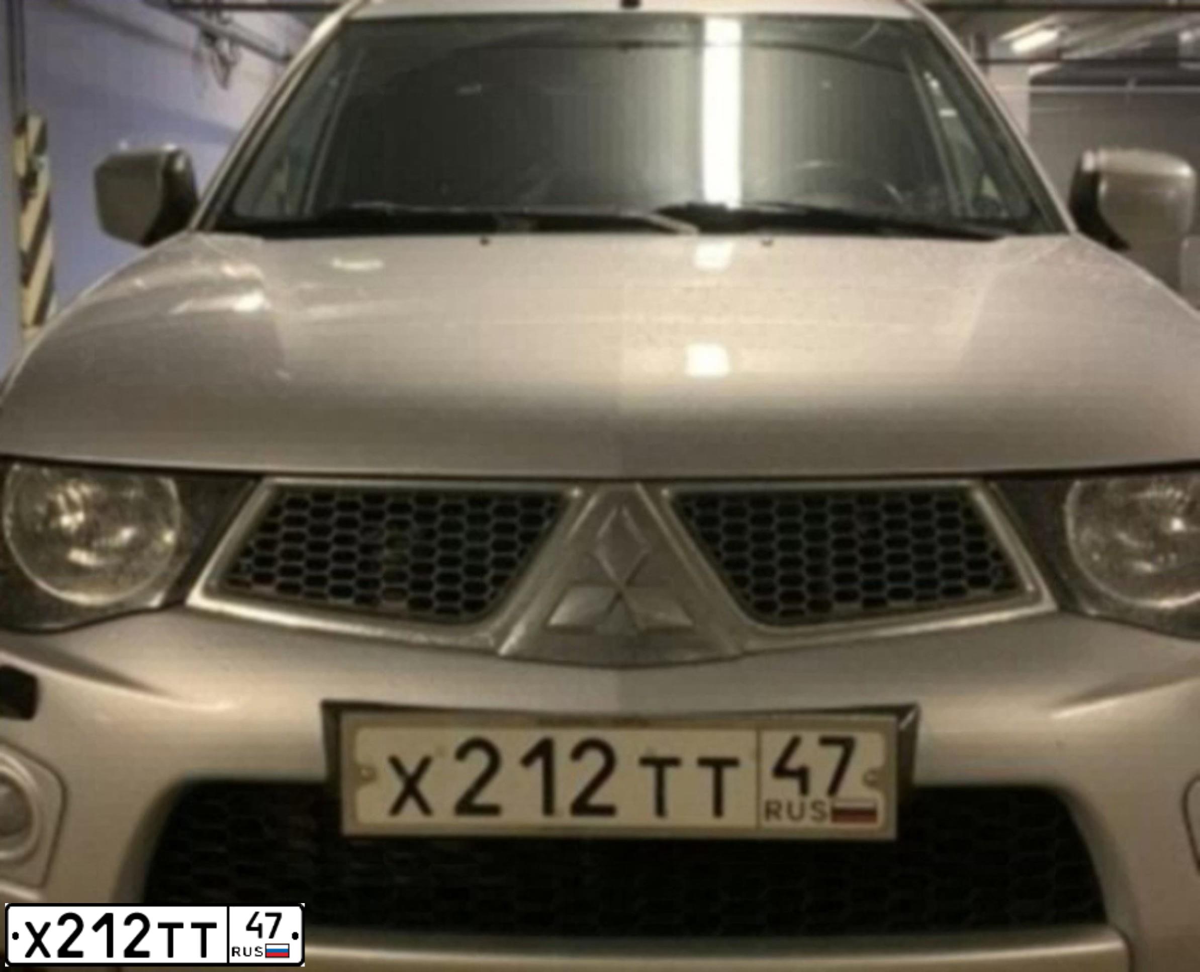 Фото автомобиля MITSUBISHI L 200, 2010 — госномер Х212ТТ47. Цвет: СЕРЕБРИСТЫЙ