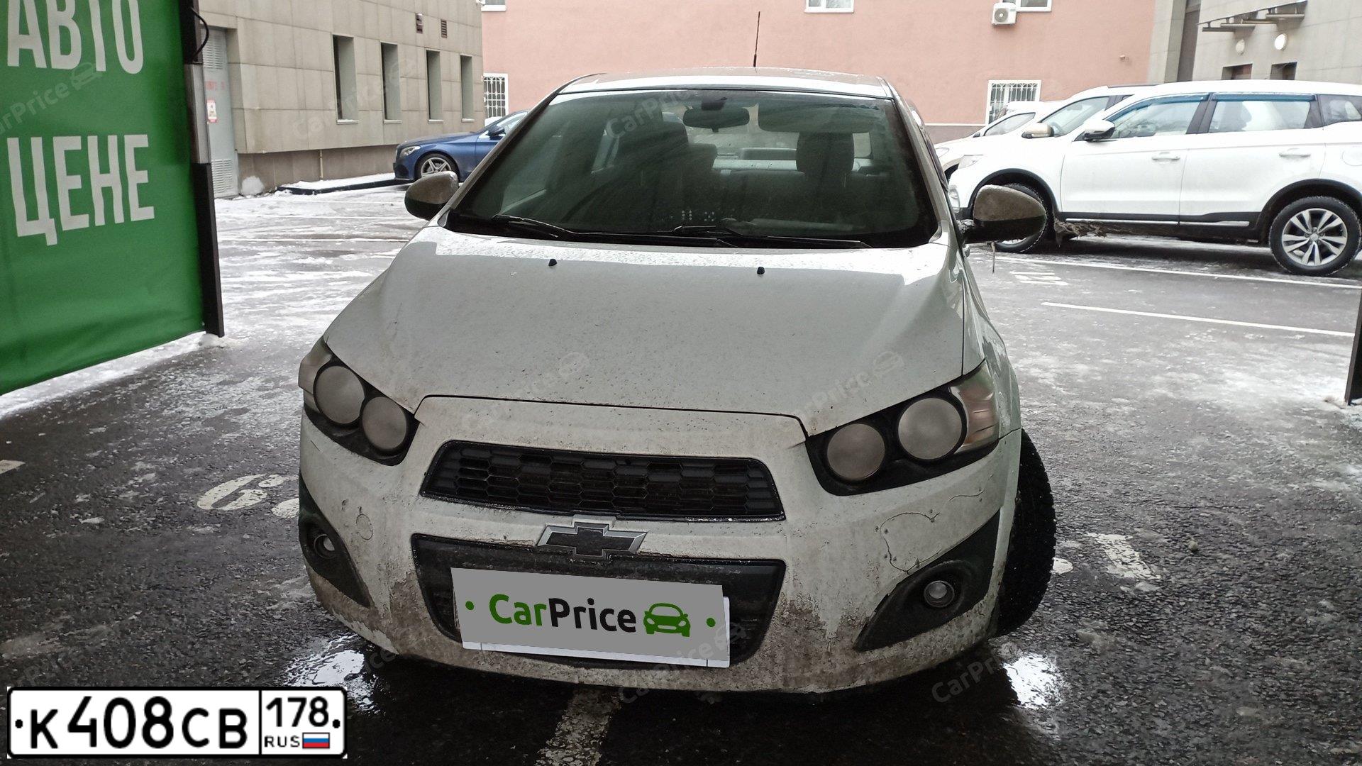 Фото автомобиля CHEVROLET AVEO, 2012 — госномер Р298МН70. Цвет: БЕЛЫЙ