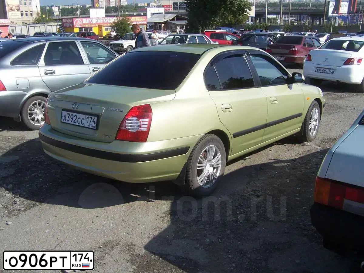 Фото автомобиля LADA 2112, 2004 — госномер О906РТ174. Цвет: Красно-оранжевый